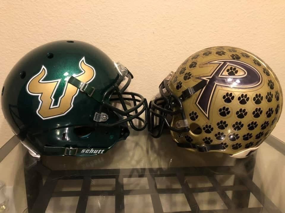 USF and Plant High School helmets facing each other